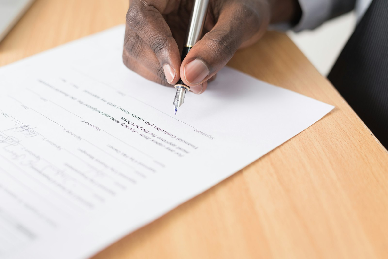 Person signing real estate closing documents